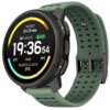 Smartwatch z zielonym paskiem i okrągłym wyświetlaczem pokazuje godzinę 19:36:54, datę SAT AUG 23, poziom naładowania baterii 92%, temperatury -2°C i 9°C, oraz napis "Halti" i "BROKEN CLOUDS 5°C". Na górze ekranu widoczny jest czas do zachodu słońca: "SUN