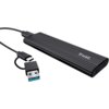 Czarna obudowa dysku z logo "Trust" na powierzchni, z podłączonym kablem USB-C oraz adapterem USB. Produkt ma żebrowaną strukturę i prostokątny kształt.