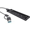 Czarna obudowa dysku z widocznymi złączami i otworami montażowymi, obok której znajduje się kabel z końcówkami USB i USB-C. Produkt to "Obudowa dysku TRUST 25806".