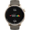 Złoty smartwatch z okrągłym wyświetlaczem pokazuje dane dotyczące tętna: "Średnio 135", "Aktualne 120" z ikoną serca i kolorowym wykresem słupkowym, oraz "Maks. 148". Pasek zegarka jest w ciemnym kolorze, a na tarczy widoczne są oznaczenia minutowe.
