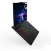 Na zdjęciu widoczny jest laptop z podświetlaną klawiaturą w różnych kolorach oraz ekranem wyświetlającym grafikę z napisem "Legion". W górnym rogu ekranu znajduje się logo w kształcie tarczy.