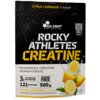 Opakowanie produktu z napisem "OLIMP SPORT NUTRITION ROCKY ATHLETES CREATINE" oraz informacjami: "CITRUS LEMONADE FLAVOUR", "Micronized Creatine Monohydrate", "3 g of creatine per portion", "Sugar Free", "121 portions", "500 g". Na dole widoczne są ilustr