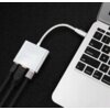 Na zdjęciu widoczny jest srebrny hub z logo "zenwire", podłączony do laptopa za pomocą kabla USB typu C. Hub ma trzy porty, do których podłączone są różne kable.