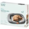 Opakowanie produktu z napisem "Love Your Pet by beurer" oraz "Kira Heated Bed WÄRMEBETT" przedstawia szare legowisko z psem w środku. Na opakowaniu znajdują się również napisy "for Cats & Dogs", "Made by us, loved by pets" oraz oznaczenie "German Engineer
