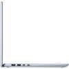 Przedstawiony jest srebrny laptop w pozycji bocznej, z widocznymi portami, w tym HDMI, USB i USB-C. Laptop jest częściowo otwarty, ukazując cienki profil urządzenia.