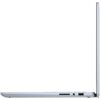 Srebrny laptop w pozycji otwartej, widoczny z boku, ukazujący cienki profil urządzenia. Na krawędzi znajdują się porty, w tym gniazdo słuchawkowe i port USB.