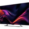 Telewizor SHARP 65HR8765E 65" QLED 4K z cienką ramką, wyświetlający abstrakcyjną grafikę w odcieniach fioletu, różu i pomarańczu. Na dolnej ramce widoczne jest logo "SHARP".