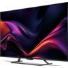 Telewizor z cienką ramką wyświetla abstrakcyjną grafikę w odcieniach fioletu, różu i pomarańczu. Na dolnej ramce widoczny jest napis "SHARP".