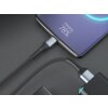 Na zdjęciu widoczny jest czarny kabel USB podłączony do smartfona, na ekranie którego wyświetla się napis "Charging 78%". Kabel ma plecioną osłonę i jest podłączony do ładowarki.