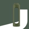 Oliwkowe etui o cylindrycznym kształcie z dużym, owalnym wycięciem na środku, umieszczone na tle w dwóch odcieniach zieleni i bieli. Produkt to "Etui WESSPER do B1 Borosilicate 1000 ml Oliwkowy".