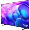 Telewizor z cienką ramką wyświetla kolorową grafikę z fioletowymi i niebieskimi bąbelkami. Na ekranie widoczne są napisy "SAMSUNG" i "QLED".