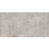 Na zdjęciu widoczna jest płytka o matowej, szarej powierzchni z delikatnym wzorem przypominającym beton. Tekstura jest jednolita, bez widocznych napisów czy logo.