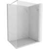 Przezroczysta ścianka prysznicowa typu walk-in o wymiarach 140 x 200 cm z chromowanymi elementami, zamontowana w narożniku z marmurowymi płytkami. Produkt ma minimalistyczny design z metalowym wspornikiem u góry.