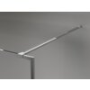 Na zdjęciu widoczna jest chromowana ścianka prysznicowa z ramką, zamontowana na szarej ścianie. Produkt ma prosty, nowoczesny design z metalowym wspornikiem przymocowanym do ściany.