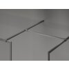 Na zdjęciu widoczna jest ścianka prysznicowa typu walk-in z metalową ramką w kolorze gun gray, wykonana z przezroczystego szkła. Produkt ma minimalistyczny design z prostymi liniami i szczotkowanym wykończeniem.