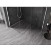 Na zdjęciu znajduje się ścianka prysznicowa typu walk-in o wymiarach 160 x 120 cm, wykonana z przezroczystego szkła o grubości 10 mm, z białymi elementami konstrukcyjnymi. W tle widoczne są ciemne płytki ułożone w jodełkę oraz szare, marmurowe płytki podłogowe.