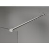 Przezroczysta ścianka prysznicowa z grubego szkła o grubości 10 mm, zamocowana na metalowym wsporniku w kolorze niklu szczotkowanego, przymocowanym do ściany. Produkt ma minimalistyczny design i jest przeznaczony do montażu typu walk-in.