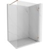 Przeszklona ścianka prysznicowa typu walk-in o wymiarach 60 x 200 cm, wykonana z transparentnego szkła o grubości 8 mm, z elementami w kolorze różowego złota. Ścianka jest zamontowana w narożniku łazienki wykończonej w jasnym marmurowym wzorze.