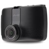 Czarny wideorejestrator z obiektywem oznaczonym napisem "HIGH-DEFINITION VIDEO WIDE ANGLE CAMERA" oraz logo "mio" na obudowie. Urządzenie ma nowoczesny design z teksturowanymi elementami po bokach.