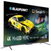 Telewizor z wyświetlaczem prezentującym żółty samochód wyścigowy z napisami: "BLAUPUNKT", "Google TV", "4K", "MiniLED", "MEMC", "Dolby ATMOS", "Dolby AUDIO", "Dolby VISION", "144 Hz", "Series MCG8000S", "55" oraz logo "IRON LYNX".