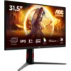 Monitor AOC o przekątnej 31,5 cala wyświetla dynamiczną scenę z postacią w zbroi na tle architektury, z widocznymi napisami: "UHD 160Hz ↔ FHD 320Hz", "IPS", "1MS GTG", "ADAPTIVE SYNC", "WIDE COLOUR GAMUT", "VESA CERTIFIED DisplayHDR 400", "MOTION BLUR REDUCTION". Logo AOC znajduje się w prawym górnym rogu ekranu.