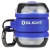 Niebieska latarka z czarnymi i przezroczystymi elementami, z widocznym logo "OLIGHT" na boku. Latarka posiada metalowy karabińczyk do mocowania.