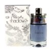Na zdjęciu znajduje się flakon perfum z niebieskim płynem oraz pudełko z napisem "shadow" i "Eau De Parfum". Na pudełku widoczne są również grafiki przypominające przyprawy oraz logo "AJMAL" z oznaczeniem pojemności 75 ml.