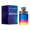 Na zdjęciu znajduje się niebieskie pudełko z napisem "HALLOWEEN MAN HERO" oraz "JUMP INTO THE BLUE", obok którego stoi butelka perfum o gradientowym kolorze przechodzącym od niebieskiego przez różowy do żółtego. Na dole pudełka widnieje napis "125 ml HALLOWEEN 4.2 FL.OZ".