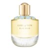 Butelka perfum o pojemności 90 ml z napisem "GIRL of NOW ELIE SAAB" na froncie, z przezroczystym, żłobionym szkłem u dołu i złotym korkiem ozdobionym niebieskimi detalami.