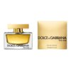 Flakon perfum o złotym zabarwieniu z napisem "Dolce & Gabbana The One" obok złotego pudełka z tym samym napisem. Na pudełku widnieje dodatkowy tekst: "Eau de Parfum 75 ml e 2.5 FL.OZ.".