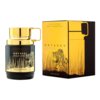 Na zdjęciu znajduje się flakon perfum oraz pudełko z napisem "ODYSSEY WILD ONE GOLD EDITION". Flakon jest ciemny z złotymi elementami, a na pudełku widoczny jest rysunek tygrysa w trawie.