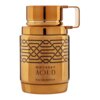 Złoty flakon perfum o cylindrycznym kształcie z ozdobnym wzorem w postaci czarnych linii. Na flakonie widnieje napis: "ODYSSEY AOUD EAU DE PARFUM".