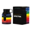 Butelka perfum i pudełko z napisem "ODYSSEY SPECTRA" oraz "RAINBOW EDITION", ozdobione kolorowymi, poziomymi paskami w odcieniach tęczy. Na pudełku widnieje również napis "EAU DE PARFUM SPRAY/VAPORISATEUR".