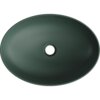 Ciemnozielona, matowa umywalka nablatowa o owalnym kształcie z centralnym otworem odpływowym. Na górnej krawędzi widoczny jest napis "MEXEN".