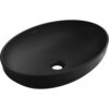 Czarna matowa umywalka nablatowa o owalnym kształcie z widocznym otworem odpływowym, na której znajduje się logo "MEXEN".