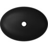 Czarna, matowa umywalka nablatowa o owalnym kształcie z centralnym otworem odpływowym. Na górnej krawędzi widoczny jest napis "MEXEN".