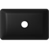 Czarna, matowa umywalka nablatowa o prostokątnym kształcie z centralnie umieszczonym otworem odpływowym. Produkt ma gładką powierzchnię i zaokrąglone rogi.
