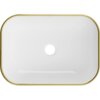 Biała umywalka nablatowa o prostokątnym kształcie z zaokrąglonymi rogami, posiada złoty rant i centralnie umieszczony otwór odpływowy. Na górnej krawędzi widoczne jest logo "Mexen".