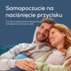 Na zdjęciu widoczny jest napis: "Samopoczucie na naciśnięcie przycisku. Z trzema ustawieniami temperatury i lampkami kontrolnymi LED." W tle znajduje się para osób przytulających się, trzymających poduszki elektryczne.
