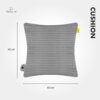 Szara poduszka elektryczna o wymiarach 40 x 40 cm z widocznym logo "Mission Air" oraz napisem "CUSHION". Poduszka ma prążkowaną teksturę i żółtą metkę.