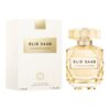 Na zdjęciu widoczna jest butelka perfum oraz pudełko z napisem "ELIE SAAB LE PARFUM LUMIÈRE". Na pudełku znajduje się także tekst "EAU DE PARFUM VAPORISATEUR SPRAY" oraz oznaczenie pojemności "e 90 ml 3 FL.OZ.".