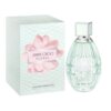 Na zdjęciu widoczna jest butelka perfum oraz pudełko z napisem "JIMMY CHOO FLORAL". Pudełko ma wzór przypominający skórę węża i różowy kwiat, a na dole znajduje się napis "EAU DE TOILETTE 90 ml e 3 FL. OZ.".