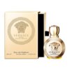Złoty flakon perfum z wytłoczonym wizerunkiem Meduzy obok otwartego pudełka z napisem "Versace Eros pour Femme Eau de Parfum 50 ml Natural Spray 1.7 US FL.OZ.".