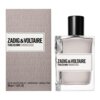 Na zdjęciu znajduje się flakon perfum oraz pudełko z napisem "ZADIG & VOLTAIRE THIS IS HIM! UNDRESSED". Na pudełku widnieje dodatkowy tekst: "IN THE NUDE IN THE N UNDRESS ZADIG UNDR THE ESSENTIAL THE ESCK SENSUAL SKIN SENSU THE NAKED TRUTH THE UNDERNEATH IT ALL A STORY OF SKIN A S", a na dole: "EAU DE TOILETTE POUR LUI - VAPORISATEUR - NATURAL SPRAY 50 ml e 1.6 FL.OZ.".