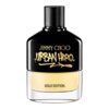 Czarno-złoty flakon perfum z napisem "JIMMY CHOO URBAN HERO" oraz "GOLD EDITION" na przezroczystej części butelki. Flakon ma czarną zakrętkę z teksturą.