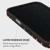 Etui na telefon z ciemnym wzorem w jasne kropki, z widocznym przyciskiem na boku. Tekst na zdjęciu: "ŁATWE ROBIENIE ZDJĘĆ Idealnie dopasowane do przycisku aparatu nowego iPhone."
