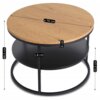 Okrągły stolik kawowy w stylu loft z blatem w kolorze dębu, o średnicy 70 cm i grubości 4 cm, posiada metalową konstrukcję z dodatkową półką o grubości 1,8 cm. Wysokość stolika wynosi 49,5 cm, a wysokość półki od podłogi to 25,5 cm.