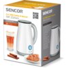 Pudełko produktu "Spieniacz SENCOR SMF 2020WH" z widocznym zdjęciem urządzenia, szklanką napoju, rogalikiem na talerzu i laskami cynamonu. Na opakowaniu znajduje się tekst: "SENCOR 2 in 1 Milk Frother & Warmer SMF 2020WH" oraz specyfikacja techniczna w ję