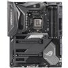 Na zdjęciu widoczna jest płyta główna z oznaczeniami "MAXIMUS X" i "FORMULA", a także logo "ROG" oraz napisy "REPUBLIC OF GAMERS" i "ASUS". Płyta posiada gniazdo procesora, cztery sloty na pamięć RAM oraz kilka złączy PCIe.