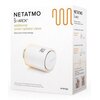 Białe opakowanie produktu z napisem "NETATMO BY STARCK additional smart radiator valve" oraz zdjęciem białej głowicy termostatycznej z numerem "20" i logo "NETATMO". Na opakowaniu znajdują się także informacje o kompatybilności oraz hasło "Save even more 